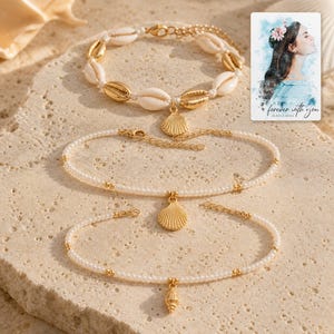 Beach Muse Three-Piece Shell Anklet Set photographed in warm natural window light in an elegant home setting.