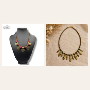 May include: Two necklaces are displayed. The first is a brown cord necklace with red textured beads and round gold-toned metal discs. The second is a beaded necklace featuring small dark beads, green and red accents, and hanging gold-toned metal leaf-shaped charms.