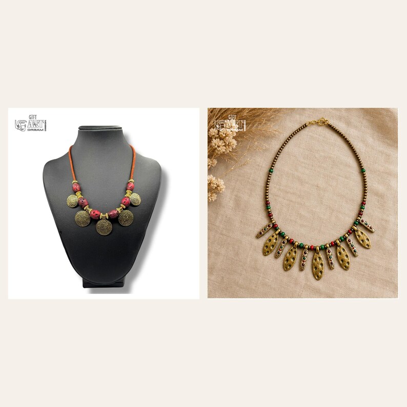 May include: Two necklaces are displayed. The first is a brown cord necklace with red textured beads and round gold-toned metal discs. The second is a beaded necklace featuring small dark beads, green and red accents, and hanging gold-toned metal leaf-shaped charms.