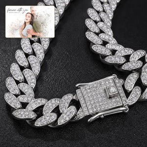 Arc Ice Cuban Necklace shown during a warm gift-receiving moment between adults with the exact jewelry visible.