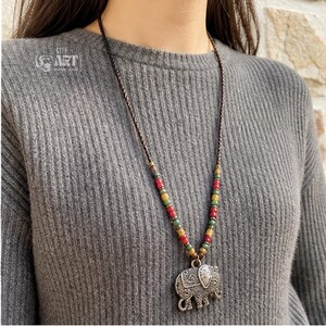 Gift box and close-up detail photo of long silver tone elephant pendant boho necklace for handmade jewelry gifting