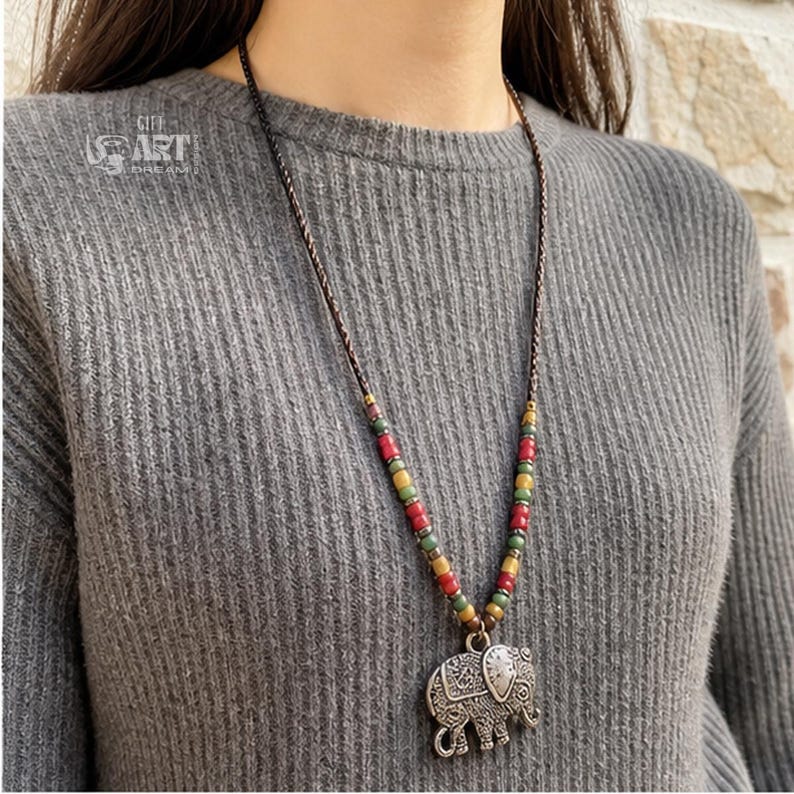 Gift box and close-up detail photo of long silver tone elephant pendant boho necklace for handmade jewelry gifting