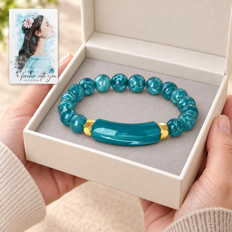 Peacock Tide Bar Bracelet shown during a believable gift-giving moment between adults with the jewelry visible. A personalized digital greeting card is shown alongside.