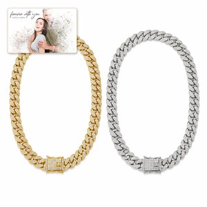 Arc Ice Cuban Necklace shown during a believable gift-giving moment between adults with the exact jewelry visible.