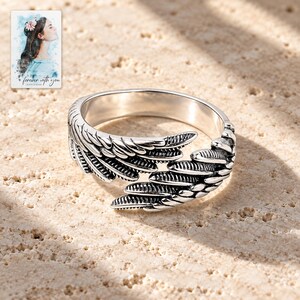 Angel Wings Wrap Ring, shown in natural light. A sample personalized digital greeting card is shown alongside.