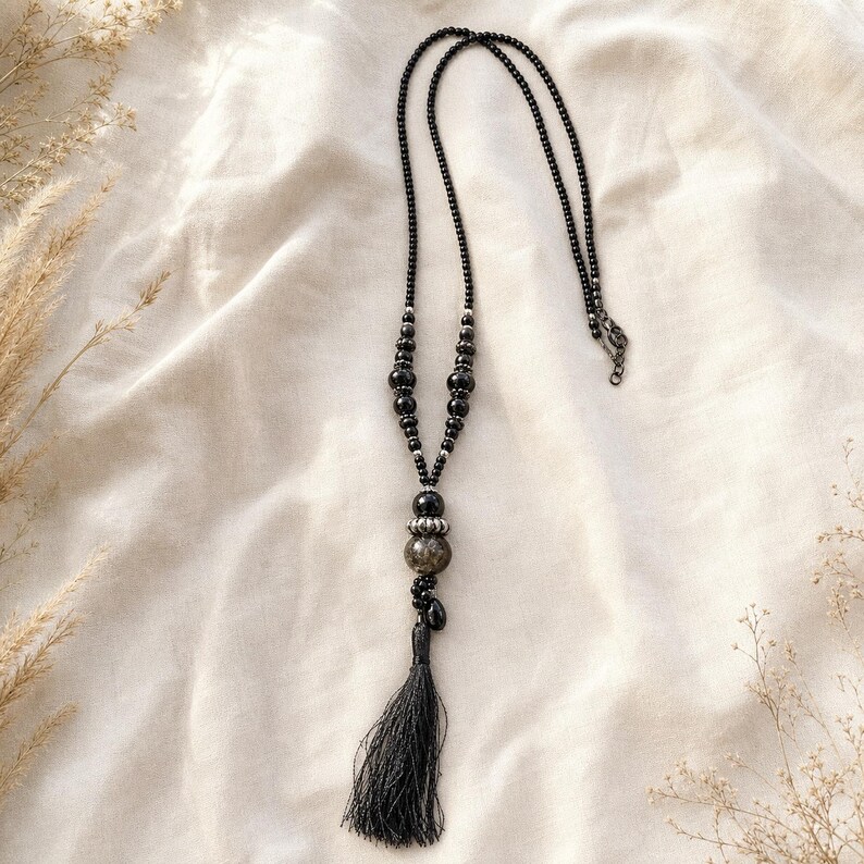 Gray and White Statement Beaded Necklace presented in an open jewelry gift box on natural linen