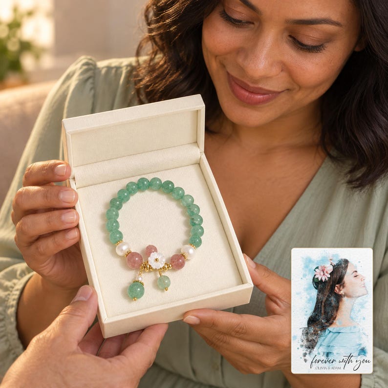 Forest Strawberry clear accents Bracelet shown during a warm gift-receiving moment between adults with the jewelry visible. A personalized digital greeting card is shown alongside.