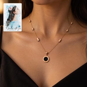 Roman Numeral Necklace, human lifestyle view. A personalized digital greeting card is shown alongside.