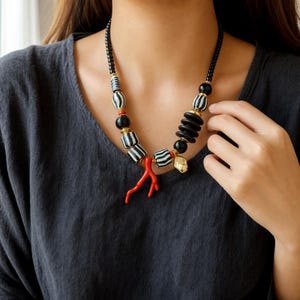 Three-piece handmade necklace set featuring red and silver beaded necklace, silver and beige beaded necklace and beige and silver beaded necklace, displayed together to show the coordinated colors and beadwork