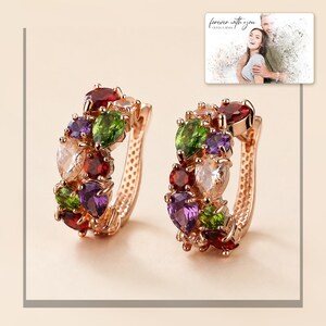 Multicolor gold-tone cluster earrings displayed beside a personalized digital greeting card example. Choose one pair.