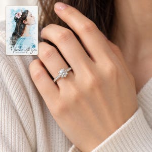 Moissanite Solitaire Ring, worn by an adult. A sample personalized digital greeting card is shown alongside.