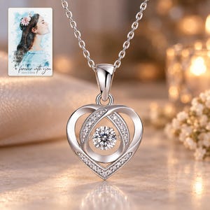 Moissanite Heart Necklace, evening style view. A personalized digital greeting card is shown alongside.