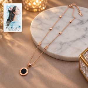 Roman Numeral Necklace, evening style view. A personalized digital greeting card is shown alongside.