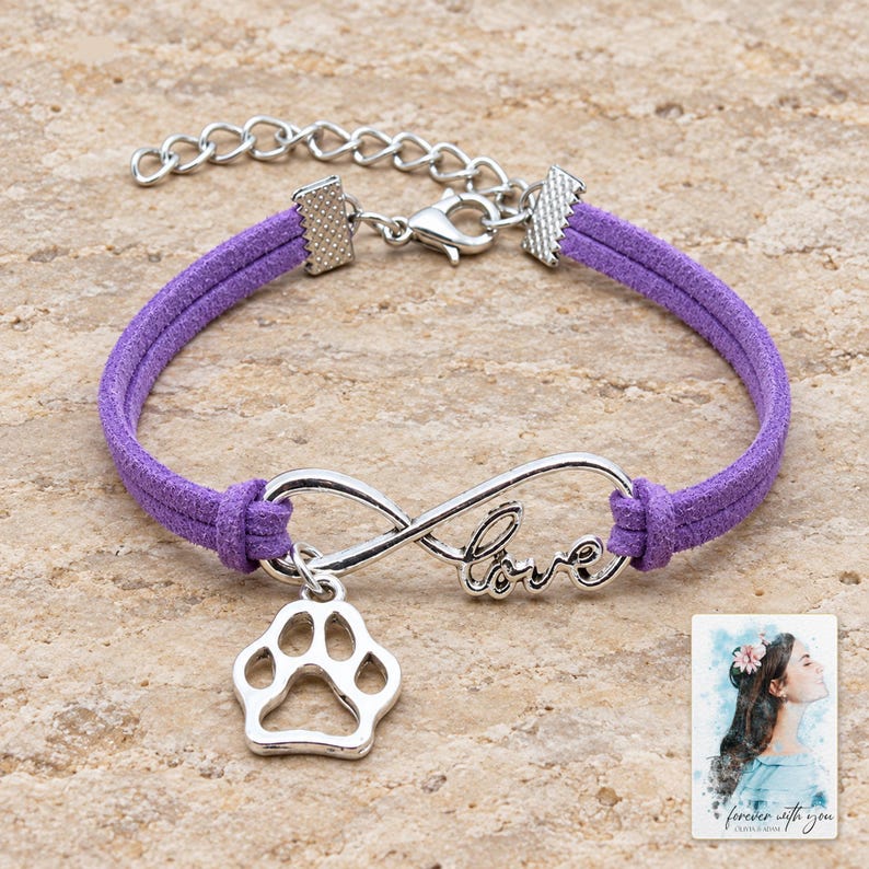 Infinity Love Paw Bracelet, shown on a display surface. A sample personalized digital greeting card is shown alongside.