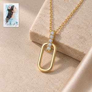 Oval Link Moissanite Necklace, close-up of the details. A sample personalized digital greeting card is shown alongside.