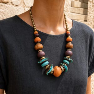 Three-piece handmade necklace set featuring rose gold and silver beaded necklace, rose gold and gray beaded necklace and rose gold and gray beaded necklace, displayed together to show the coordinated colors and beadwork