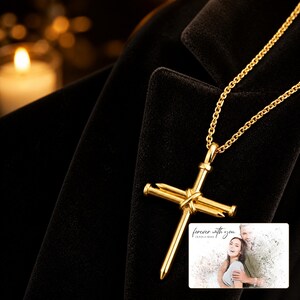 Forged Faith Nail Cross Necklace arranged on soft ivory linen in a refined neutral flat lay.