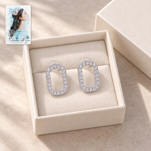 Rounded Rectangle Stud Earrings, displayed in a presentation box. A sample personalized digital greeting card is shown alongside.