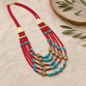 Brown and Gray Statement Beaded Necklace presented in an open jewelry gift box on natural linen