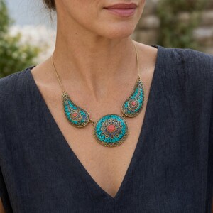 Three-piece handmade necklace set featuring silver and gray beaded necklace, silver and gray beaded necklace and silver and gray beaded necklace, displayed together to show the coordinated colors and beadwork