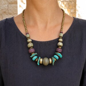 Three-piece handmade necklace set featuring rose gold and gray beaded necklace, rose gold and gray beaded necklace and rose gold and gray beaded necklace, displayed together to show the coordinated colors and beadwork