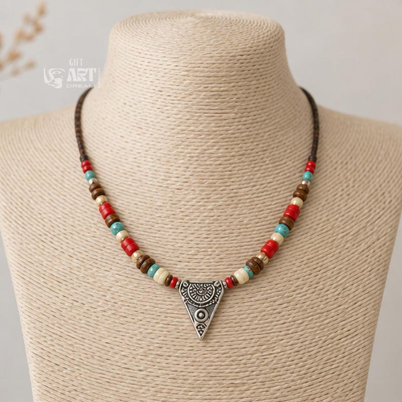 On-model lifestyle photo of multicolor beaded silver tone triangle pendant necklace worn with neutral clothing