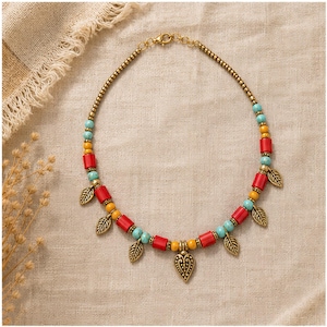 Colorful Beaded Heart Charm Necklace presented in an open jewelry gift box on natural linen