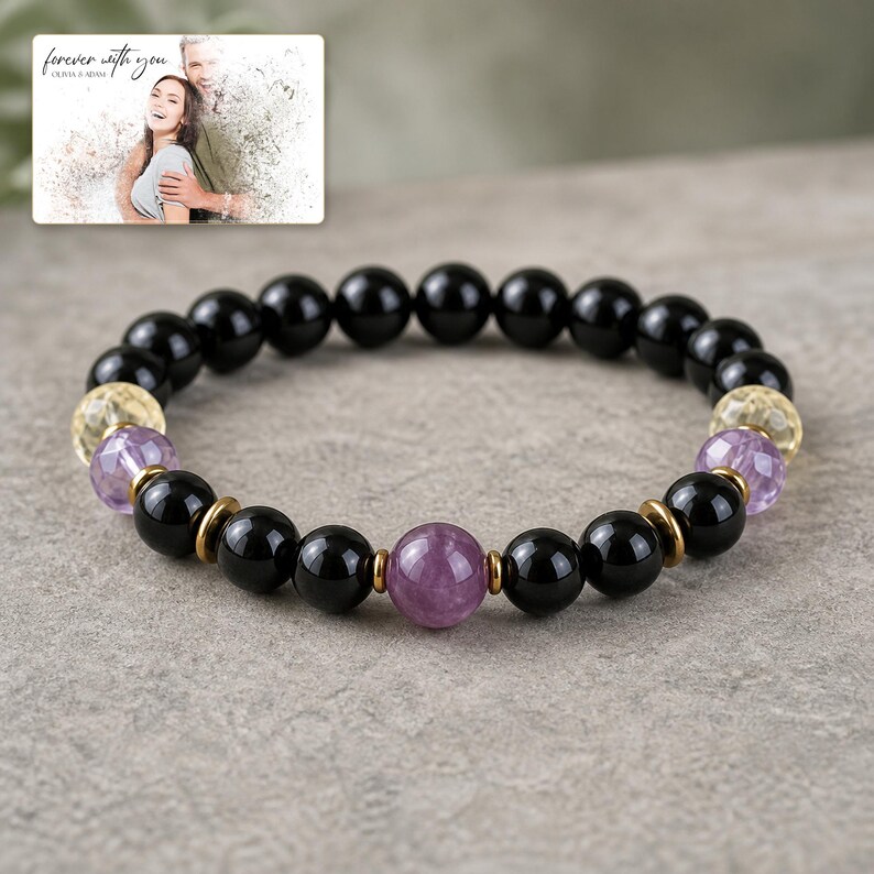 Violet Dusk Bead Bracelet photographed in warm natural window light in an elegant home setting.