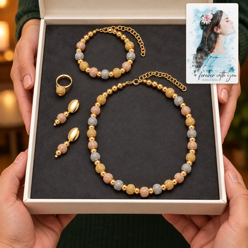 Metallic Bead Jewelry Suite shown during a warm gift-receiving moment between adults with the jewelry visible. A personalized digital greeting card is shown alongside.