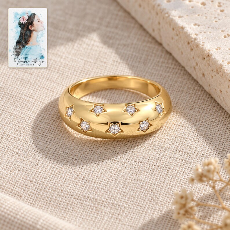 Star Set Moissanite Ring, laid on fabric. A sample personalized digital greeting card is shown alongside.