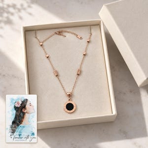 Roman Numeral Necklace, gift box view. A personalized digital greeting card is shown alongside.