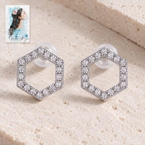 Hexagon Moissanite Stud Earrings, shown on a display surface. A sample personalized digital greeting card is shown alongside.