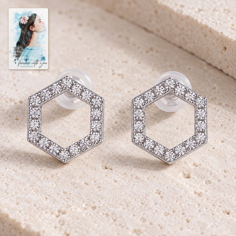 Hexagon Moissanite Stud Earrings, shown on a display surface. A sample personalized digital greeting card is shown alongside.