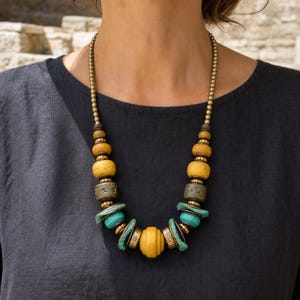 Three-piece handmade necklace set featuring rose gold and gray beaded necklace, rose gold and gray beaded necklace and rose gold and gray beaded necklace, displayed together to show the coordinated colors and beadwork