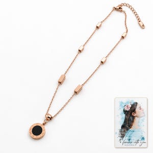 Roman Numeral Necklace, catalog view. A personalized digital greeting card is shown alongside.