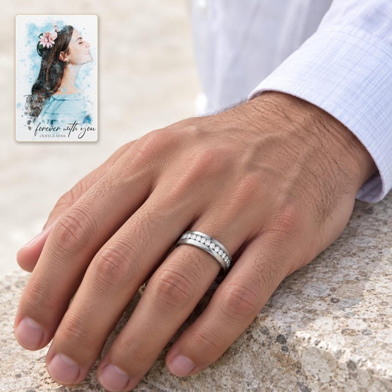 An adult man wearing one polished silver-tone clear accents band with a light cotton cuff. A personalized digital greeting card is shown alongside.