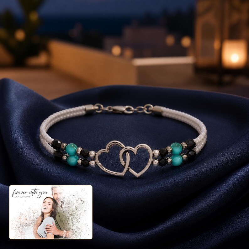 Tidal Hearts Beaded Anklet arranged on soft ivory linen in a refined neutral flat lay.