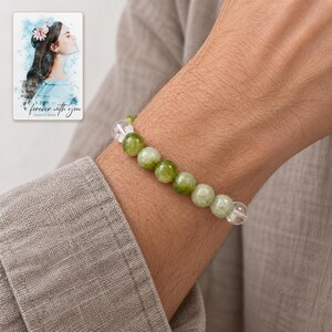 Forest Dew Bead Bracelet worn by an adult in a natural daytime lifestyle scene. A personalized digital greeting card is shown alongside.