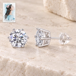 Moissanite Stud Earrings, shown on a display surface. A sample personalized digital greeting card is shown alongside.