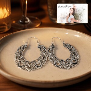 Antique Lace Boho Hoops arranged on soft ivory linen in a refined neutral flat lay.