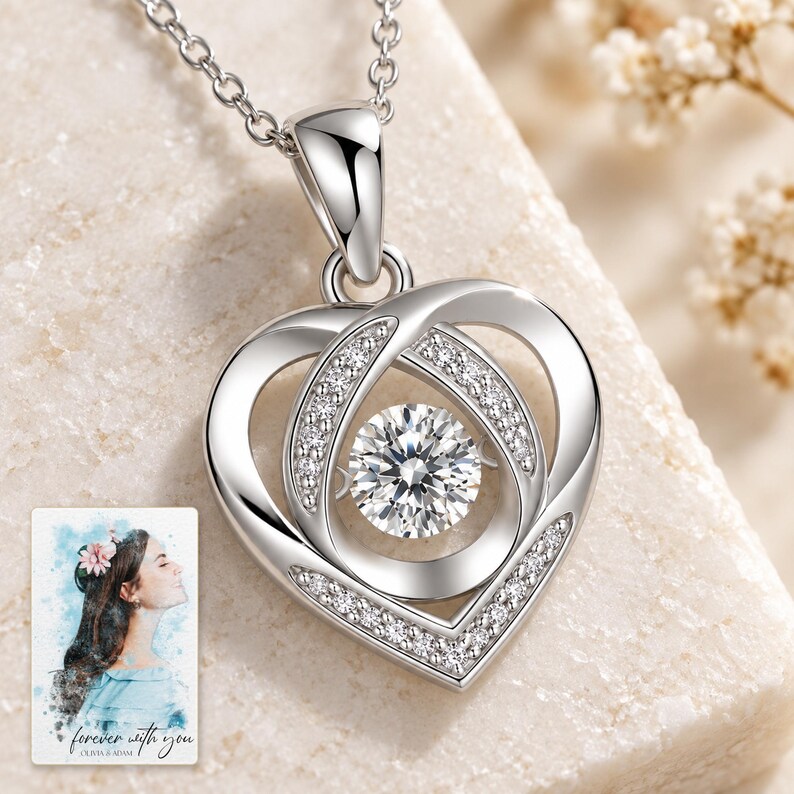 Moissanite Heart Necklace, macro detail view. A personalized digital greeting card is shown alongside.