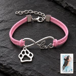 Infinity Love Paw Bracelet, shown against a dark background. A sample personalized digital greeting card is shown alongside.