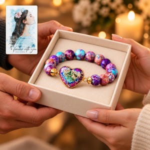 Imperial Mosaic Heart Bracelet shown during a warm gift-receiving moment between adults with the jewelry visible. A personalized digital greeting card is shown alongside.