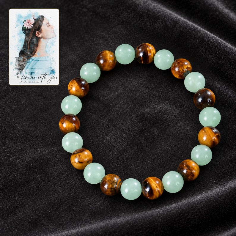 Forest Amber Bead Bracelet styled against a dark luxury surface with the exact product finish clearly visible. A personalized digital greeting card is shown alongside.