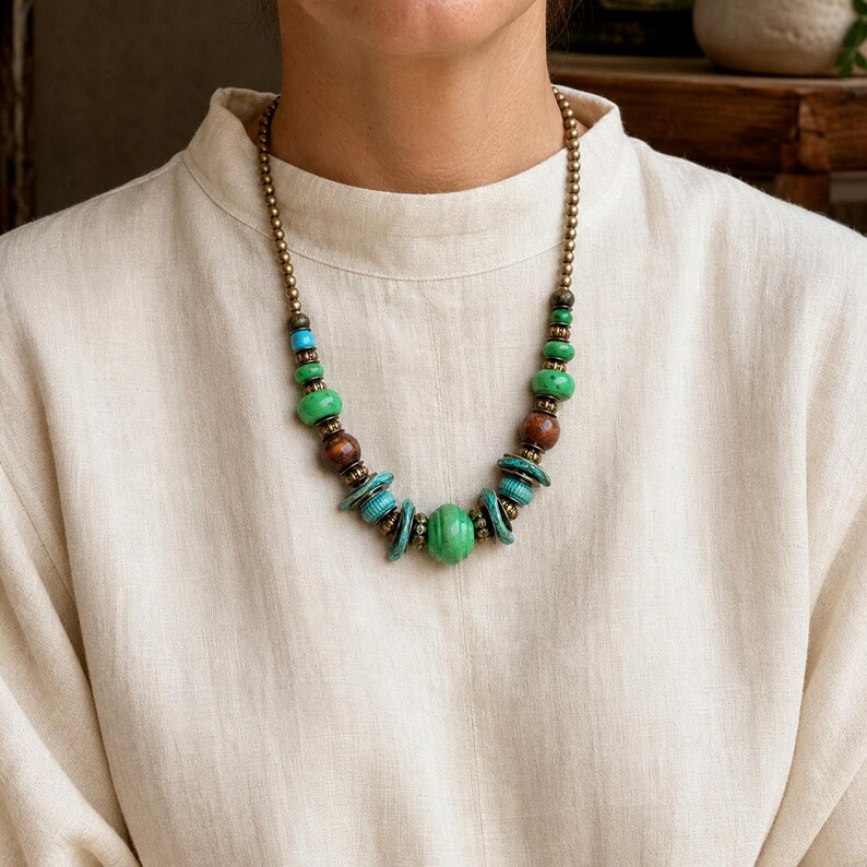 Rose Gold and Gray Statement Beaded Necklace presented in an open jewelry gift box on natural linen