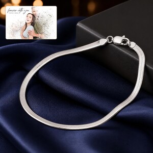 Silken Line 925 Snake Bracelet styled for an elegant evening look with the product remaining the clear focal point.
