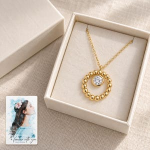 Moissanite Circle Necklace, gift box view. A personalized digital greeting card is shown alongside.
