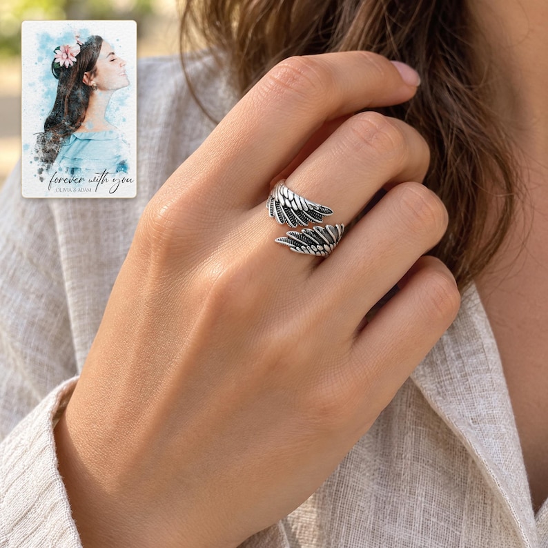 Angel Wings Wrap Ring, worn by an adult. A sample personalized digital greeting card is shown alongside.