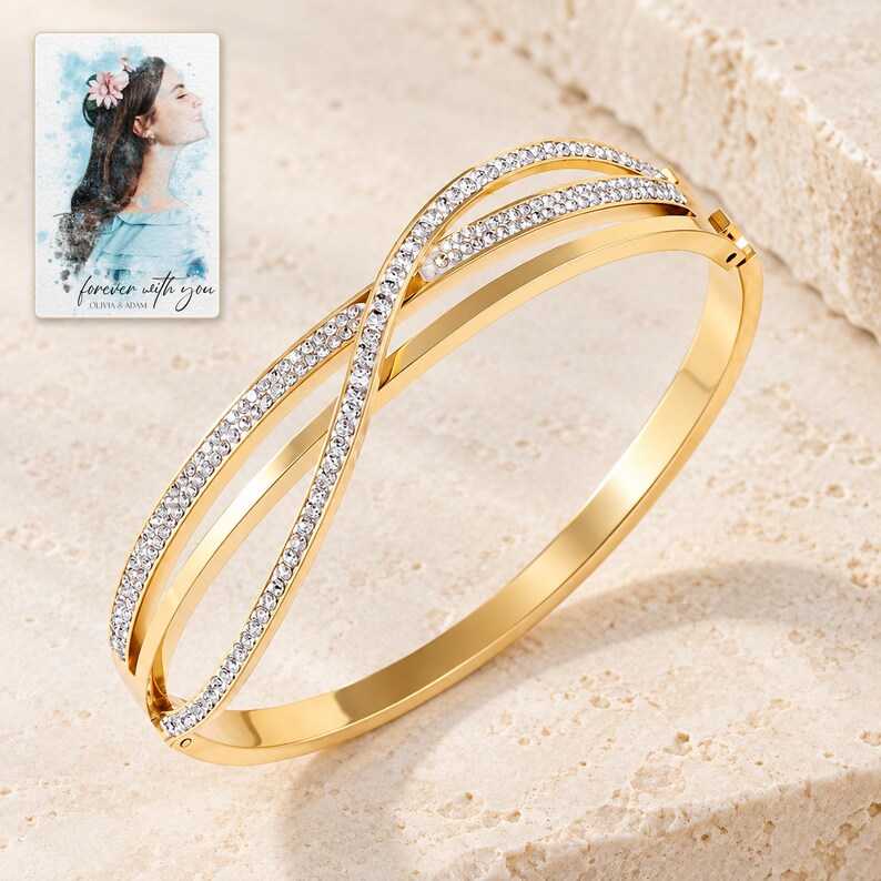 Crossover Bangle Bracelet, shown on a display surface. A sample personalized digital greeting card is shown alongside.