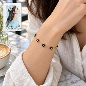 Black Disc Bracelet, worn with daytime clothing. A sample personalized digital greeting card is shown alongside.